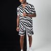 Men's stylish printed polyester tracksuit front view Back view of trendy men's polyester tracksuit Detailed print on men's polyester tracksuit Men's tracksuit in action - workout in printed polyester Comfortable and fashionable men's tracksuit